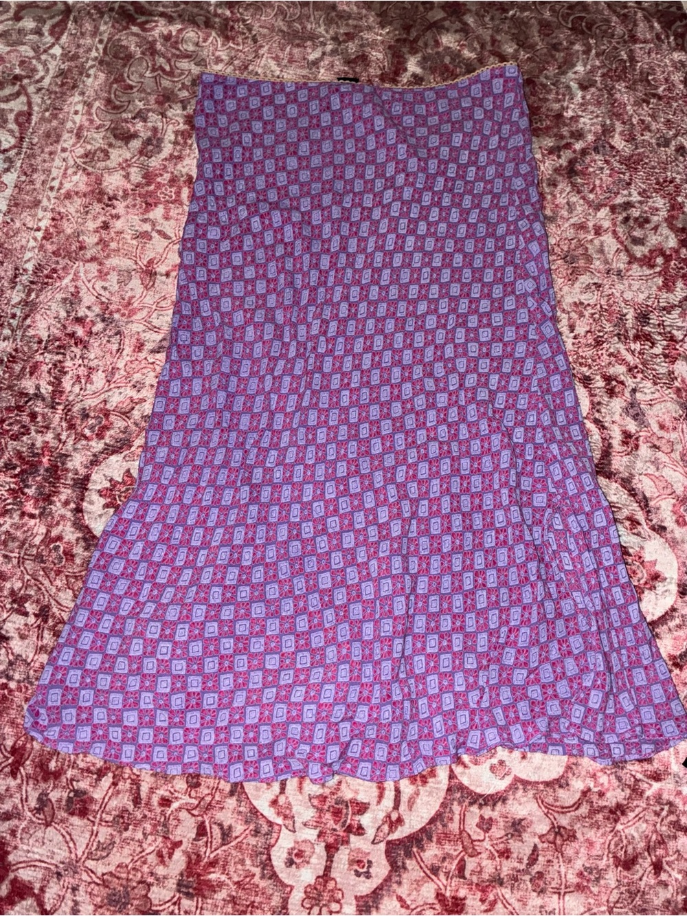 Purple & pink patterned midi skirt with a slit on the side